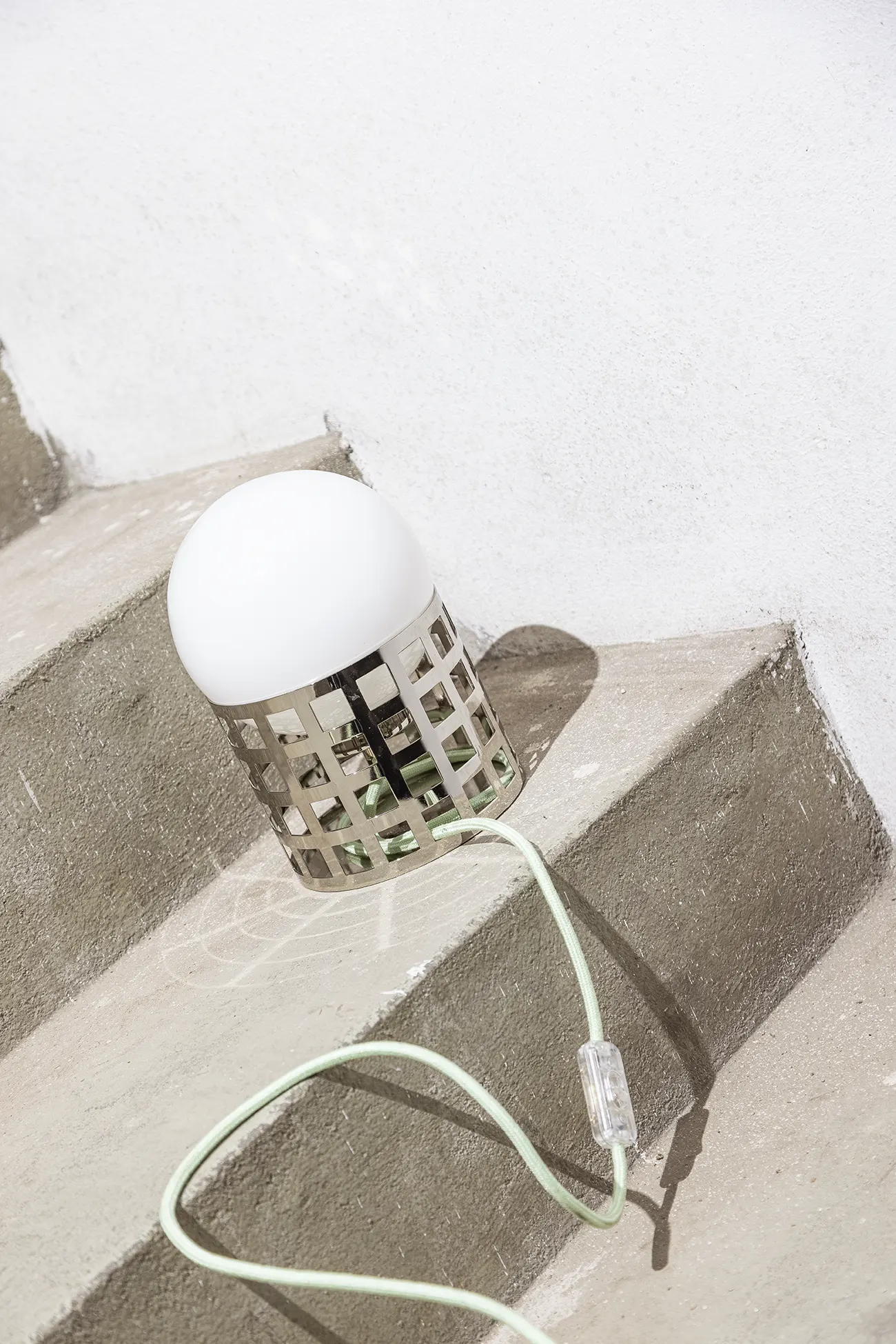 Full Moon Ride Table Lamp - Inspired by the iconic chrome finishes of the Mid Century era. Features a meticulously crafted grid pattern accentuating its geometric harmony. Conceptually alluring and transcending boundaries of conventional lighting.